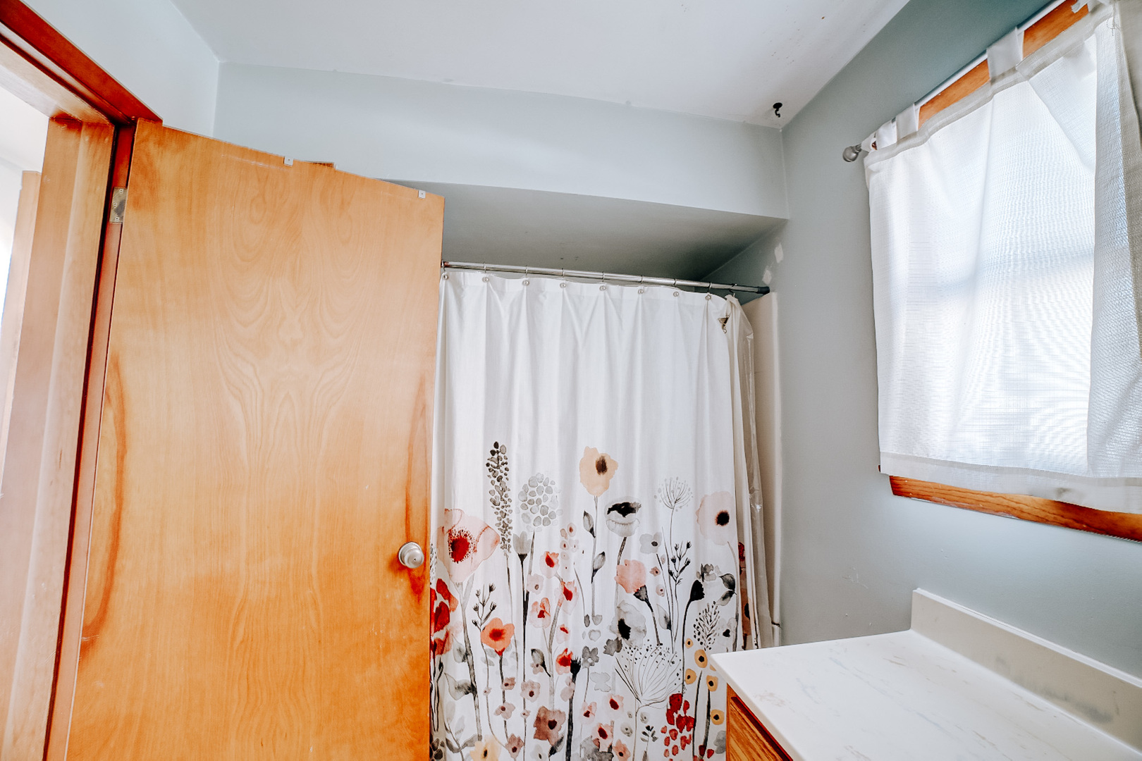 204 North Chicago Street Milford, IL 60953 - Photo 32 of 48 a bathroom with a shower curtain and a window