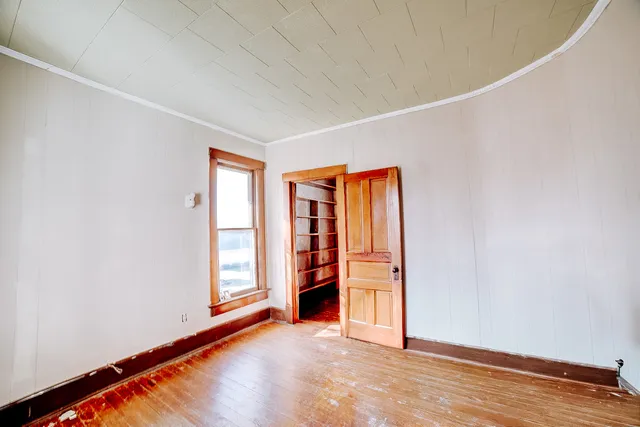 a view of an empty room with a window