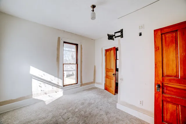 wooden floor and an empty room with windows