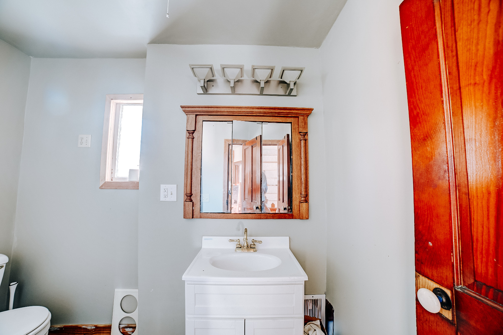 204 North Chicago Street Milford, IL 60953 - Photo 47 of 48 a bathroom with a sink and a mirror