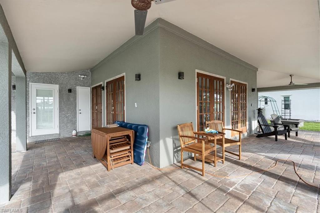 20660 Park Place Estero, FL 33928 - Photo 11 of 26 a bedroom with furniture and natural light