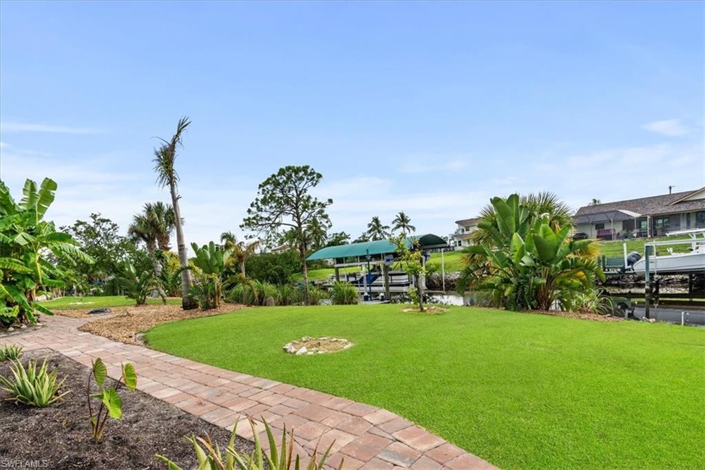 20660 Park Place Estero, FL 33928 - Photo 17 of 26 a view of a house with a yard