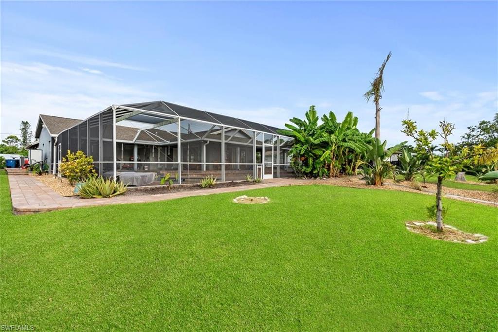 20660 Park Place Estero, FL 33928 - Photo 18 of 26 a front view of a house with a yard