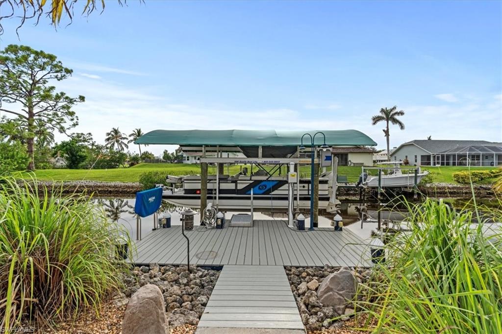 20660 Park Place Estero, FL 33928 - Photo 21 of 26 a view of a swimming pool with outdoor seating