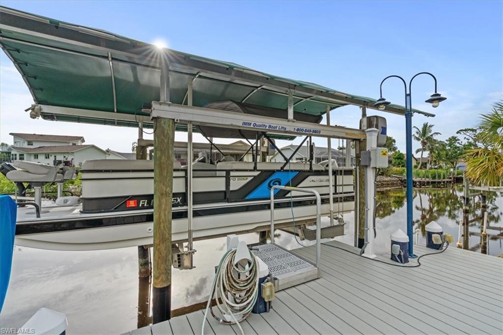20660 Park Place Estero, FL 33928 - Photo 22 of 26 a view of a chairs and table in a balcony