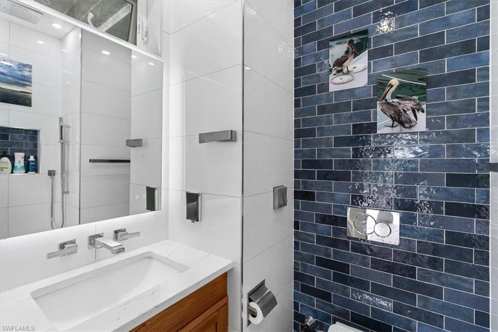 20660 Park Place Estero, FL 33928 - Photo 10 of 26 a bathroom with a sink shower and a mirror