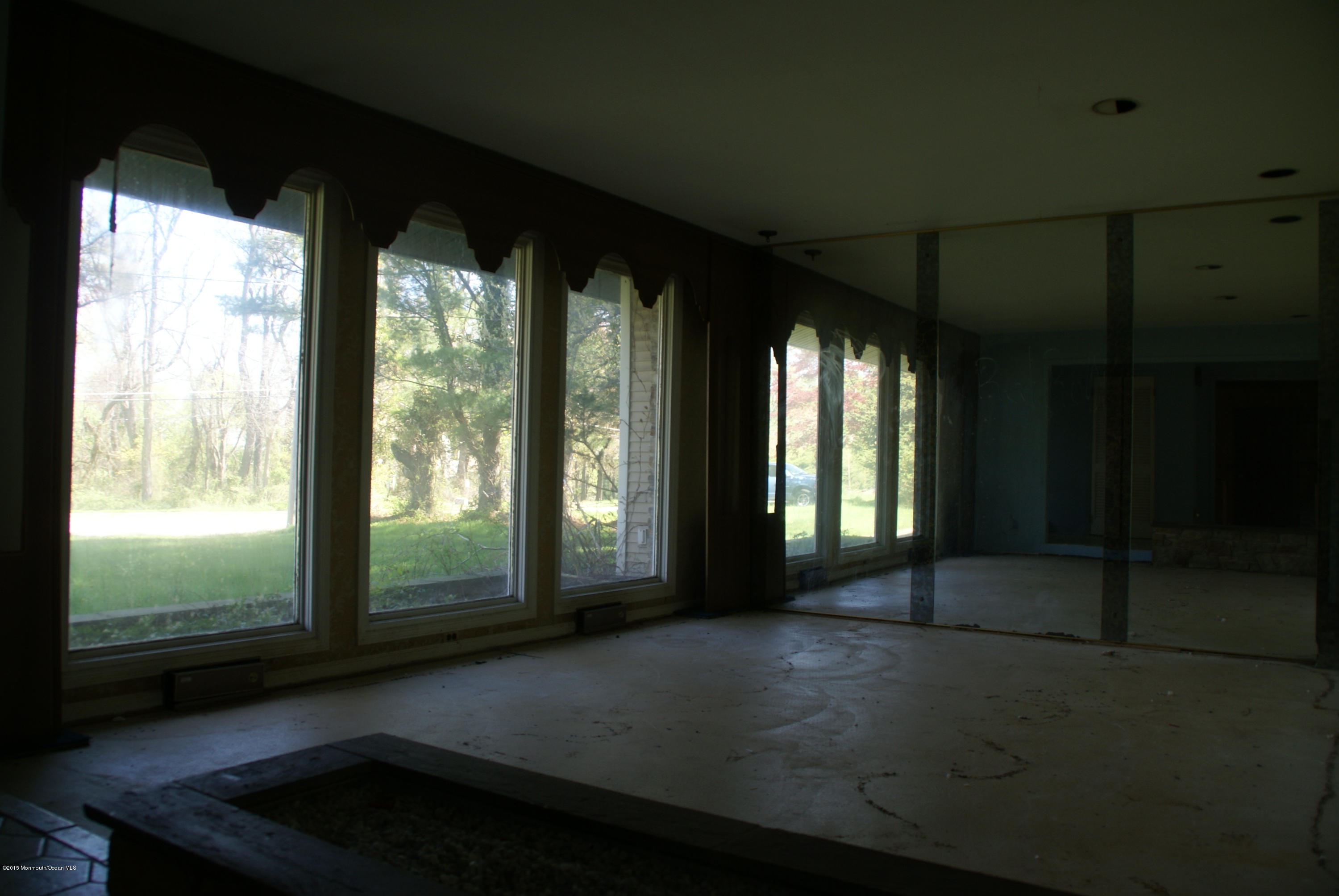 440 Burlington Road Freehold, NJ 07728 - Photo 8 of 21 a view of empty room with floor to ceiling window