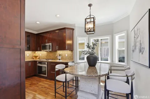 a dining room with furniture and window