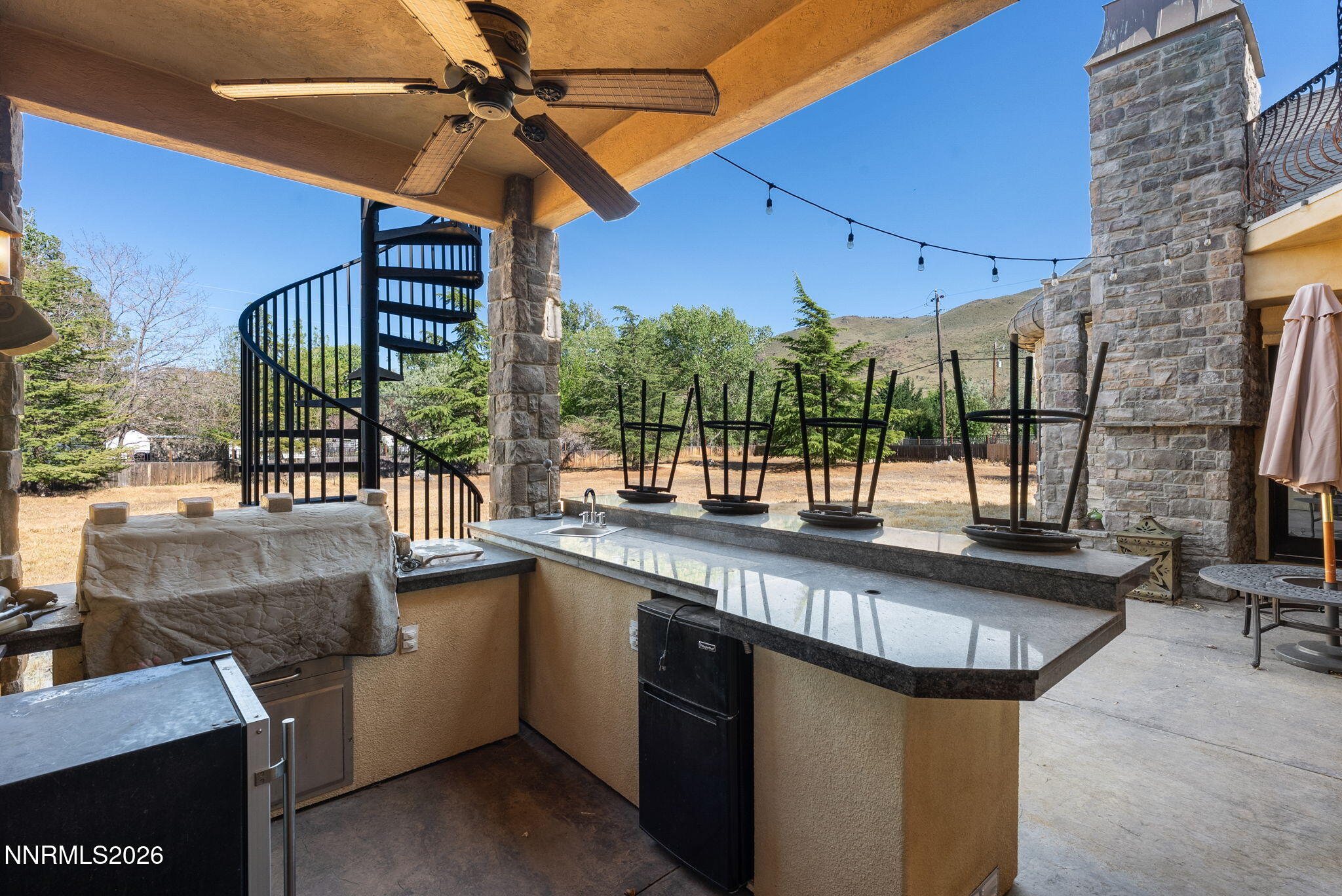 123 Andrew Lane Reno, NV 89521 - Photo 43 of 50 a kitchen with a sink a counter top space and stainless steel appliances