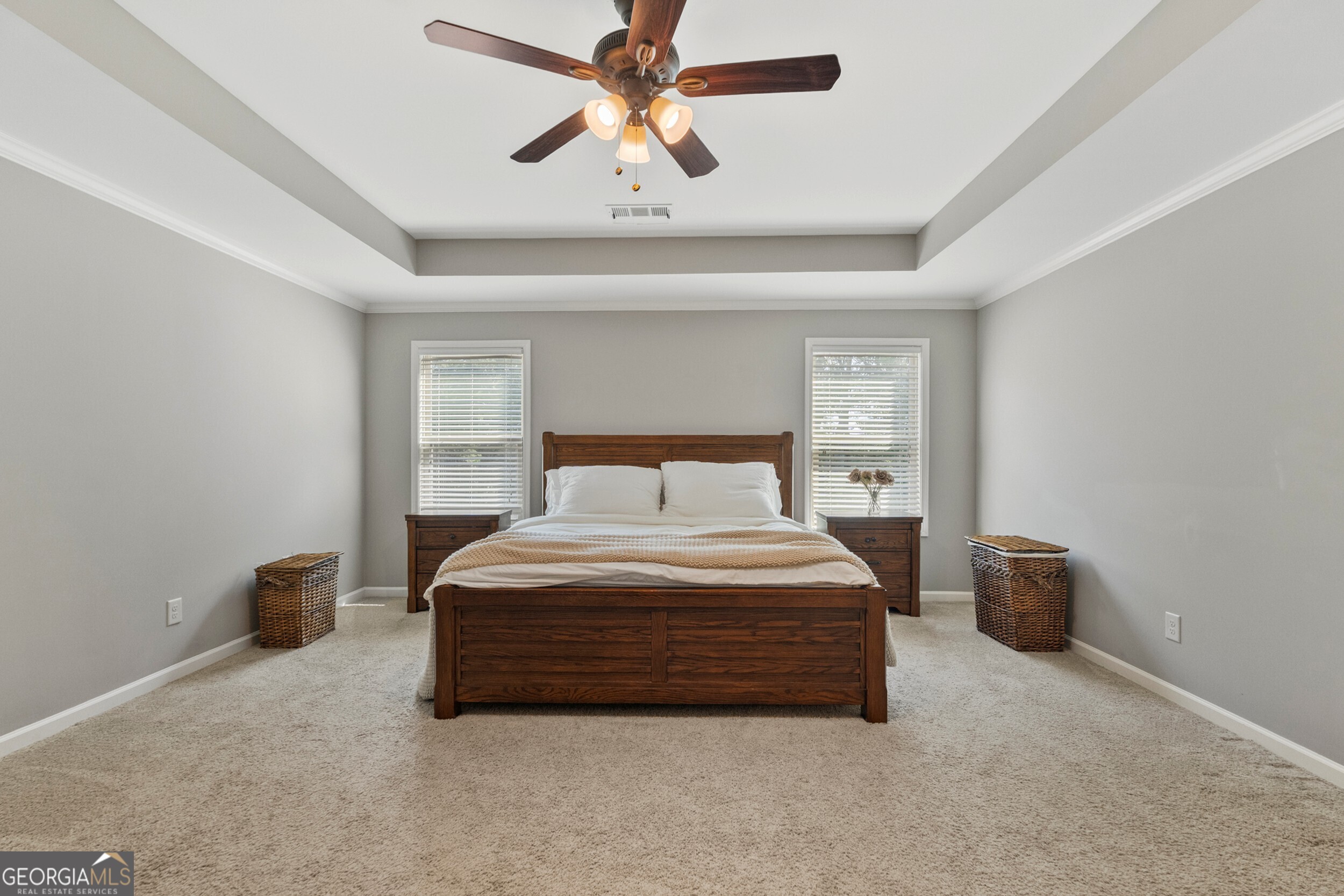 1612 Dennis Smith Road Pine Mountain, GA 31822 - Photo 13 of 33 a spacious bedroom with a bed and a chandelier