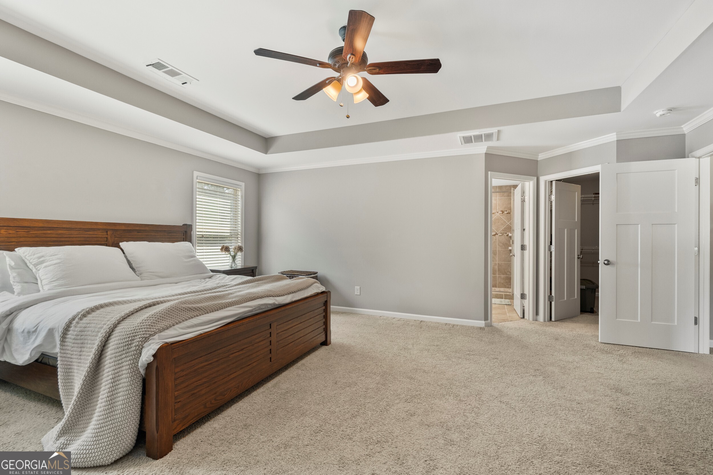 1612 Dennis Smith Road Pine Mountain, GA 31822 - Photo 14 of 33 a bedroom with a bed and a ceiling fan