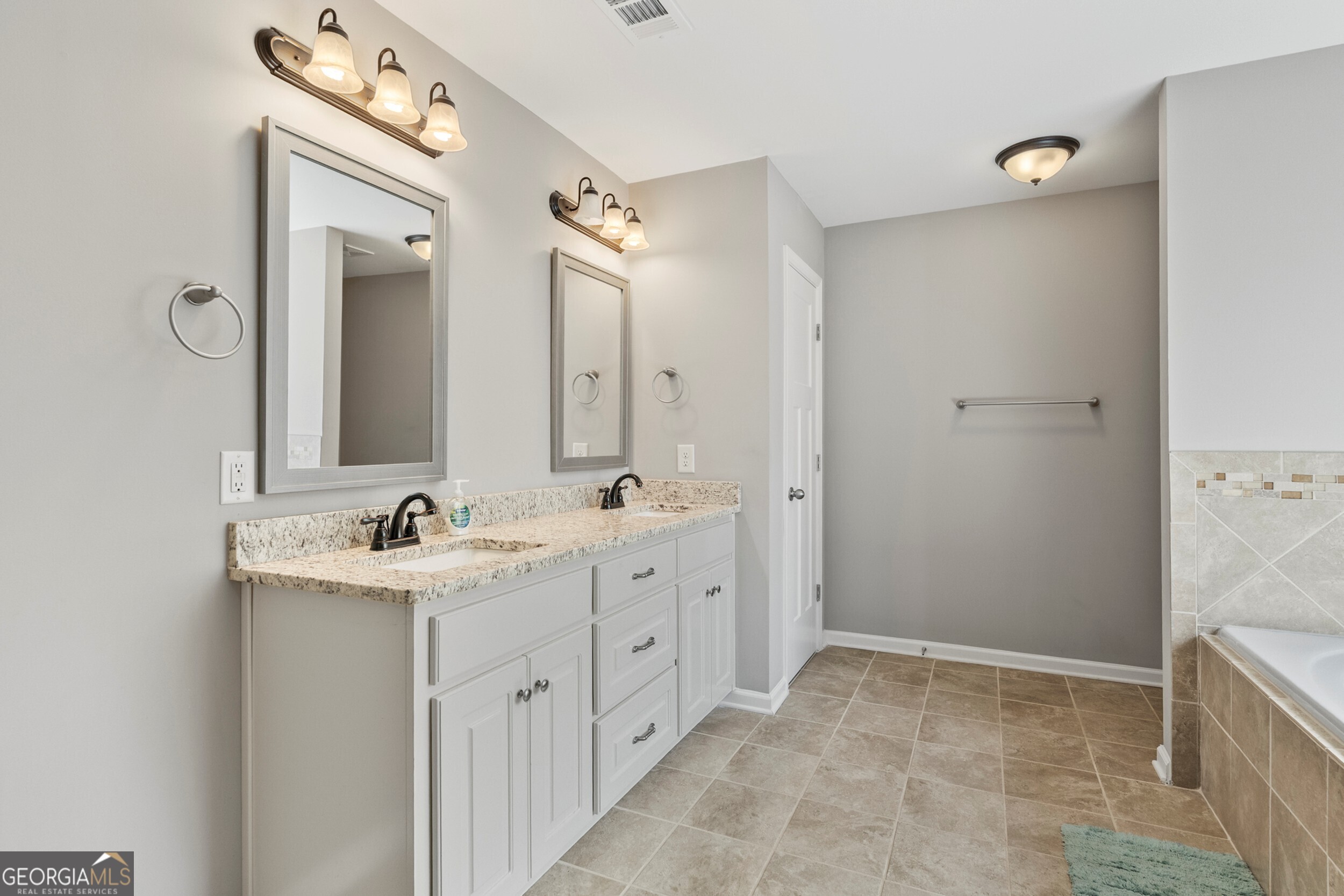 1612 Dennis Smith Road Pine Mountain, GA 31822 - Photo 17 of 33 a bathroom with double sink and mirror