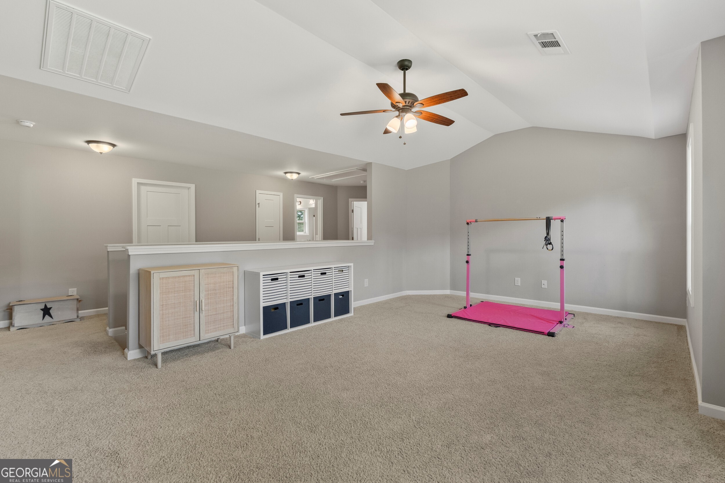 1612 Dennis Smith Road Pine Mountain, GA 31822 - Photo 25 of 33 a spacious bedroom with a bed and a chandelier