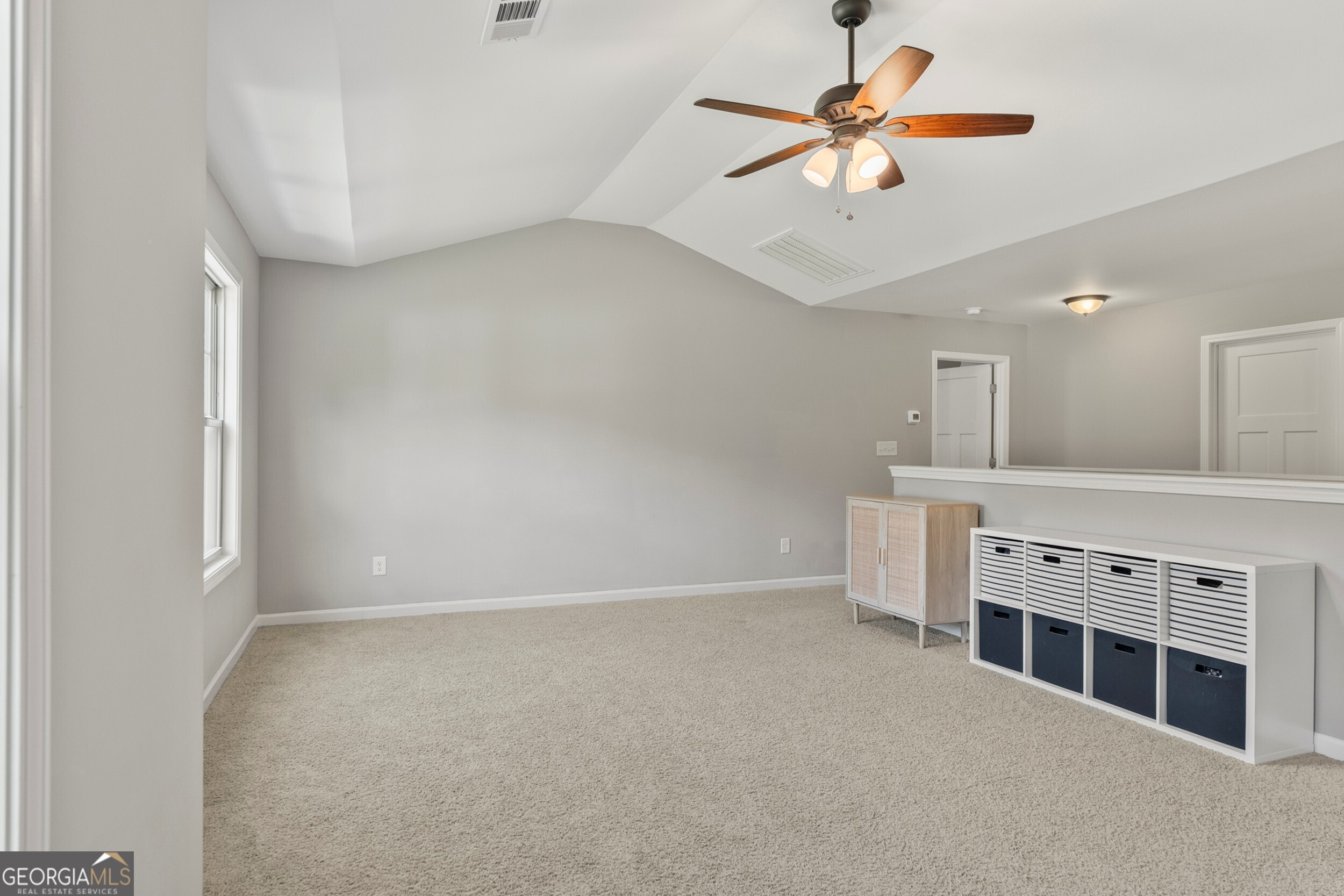 1612 Dennis Smith Road Pine Mountain, GA 31822 - Photo 26 of 33 a view of an empty room with a ceiling fan and window