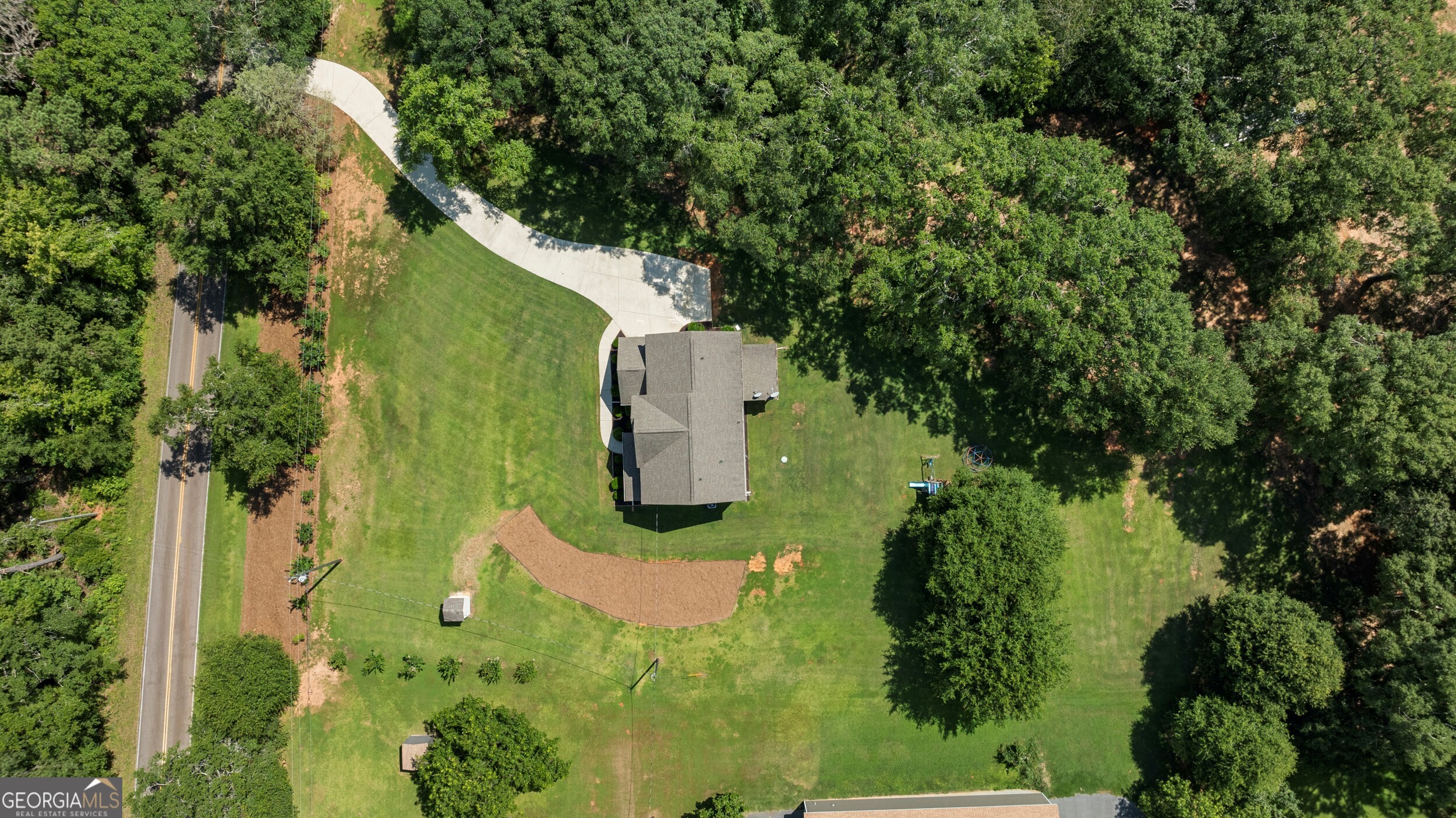 1612 Dennis Smith Road Pine Mountain, GA 31822 - Photo 29 of 33 an aerial view of a house with a yard and trees all around