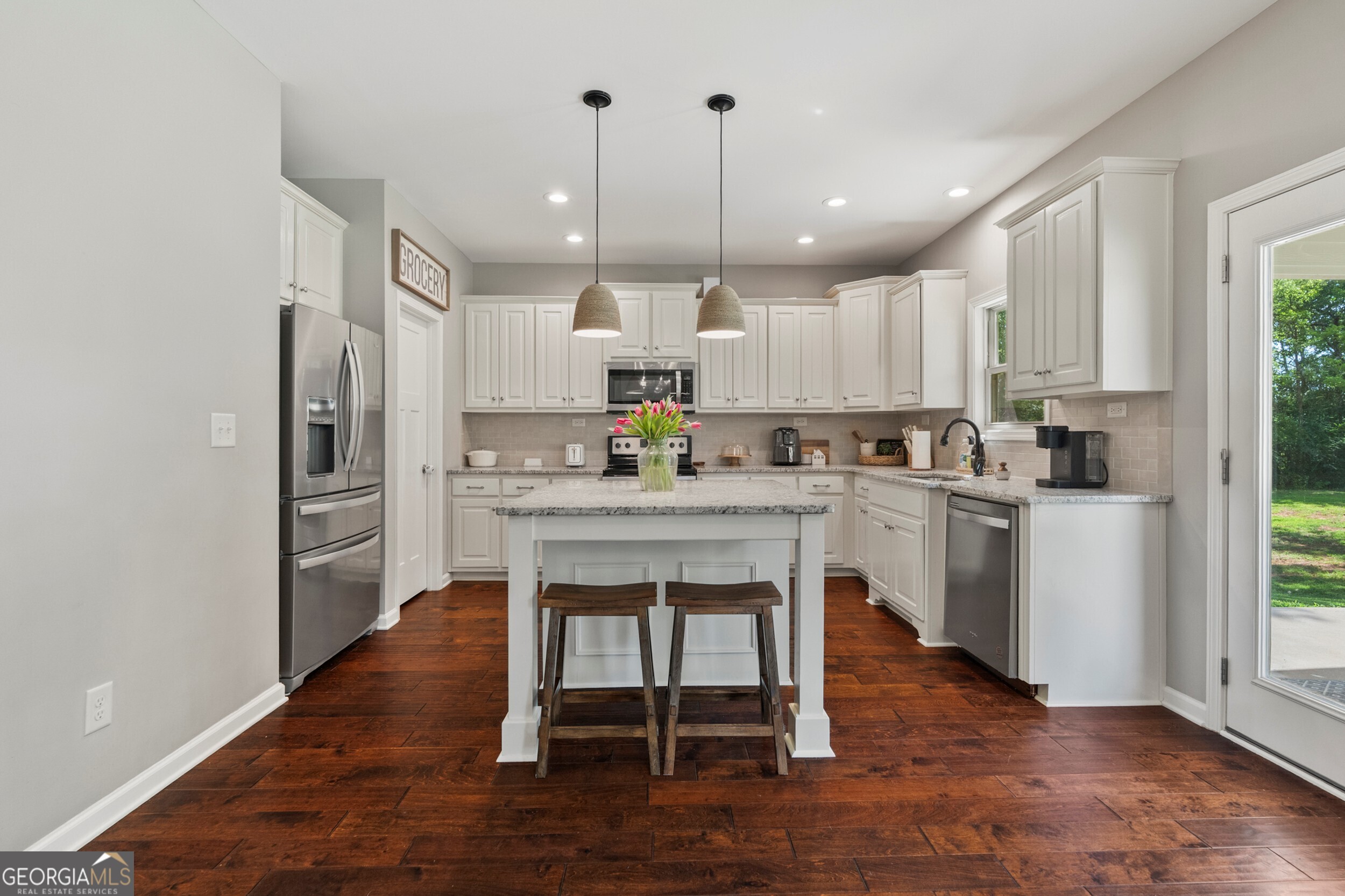 1612 Dennis Smith Road Pine Mountain, GA 31822 - Photo 5 of 33 a kitchen with kitchen island granite countertop a sink cabinets and stainless steel appliances