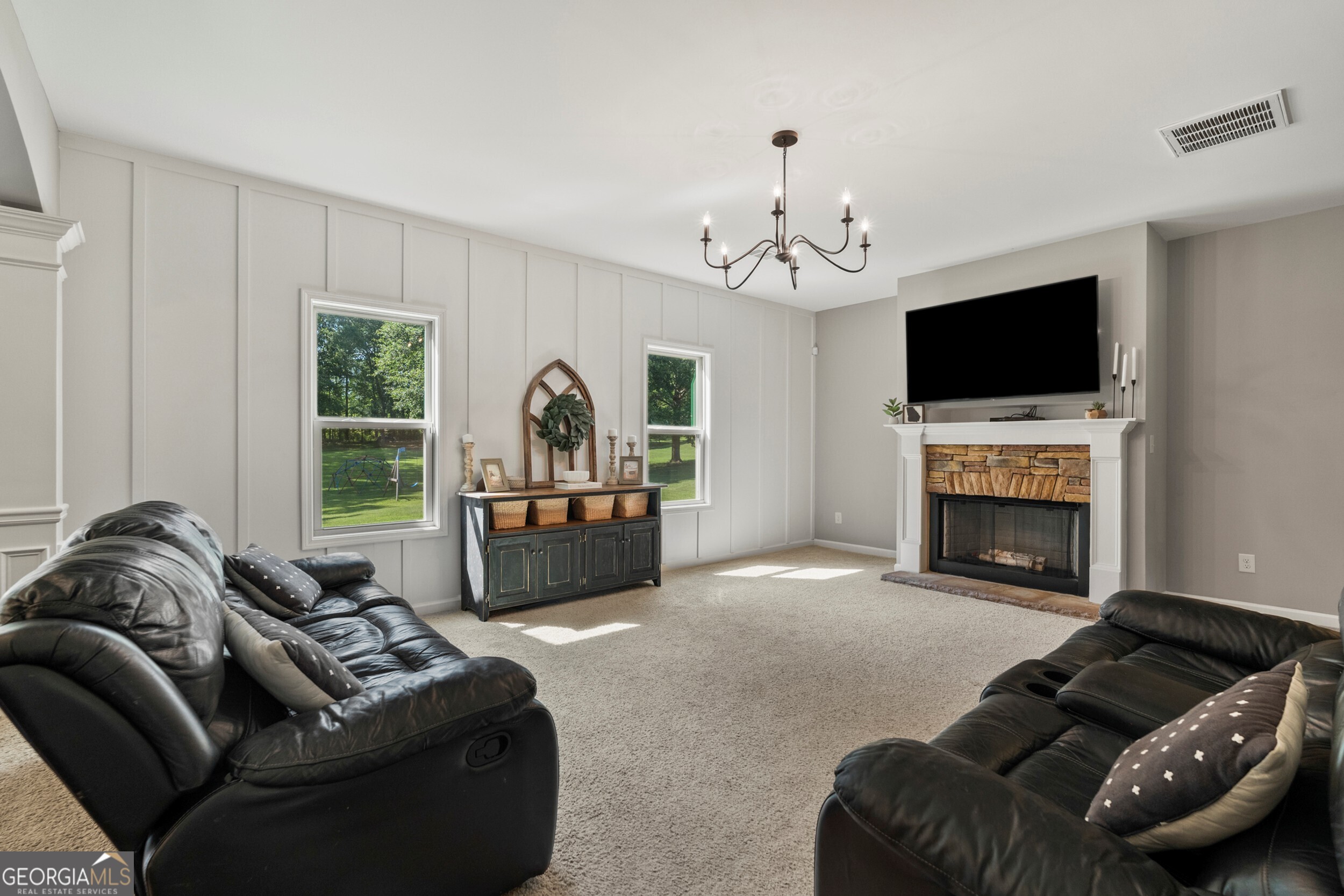 1612 Dennis Smith Road Pine Mountain, GA 31822 - Photo 9 of 33 a living room with furniture a fireplace and a flat screen tv