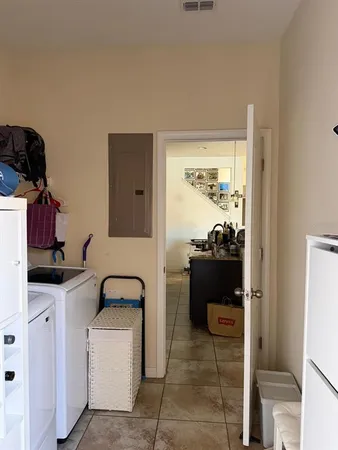 a balcony with wooden floor and a dining table