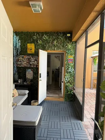 a view of a bedroom with a bed and furniture