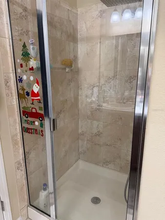 a view of staircase with lots of frames on wall