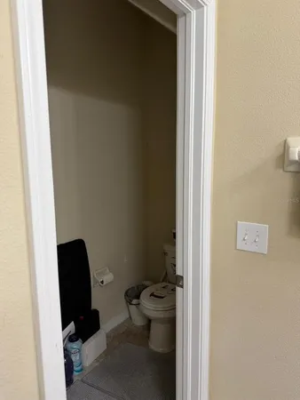 a view of staircase with lots of frames on wall