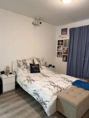 a view of a livingroom with furniture and staircase