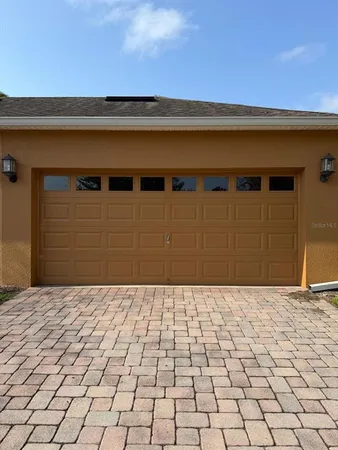 a view of a backyard of the house