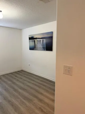 a white toilet sitting next to a bathroom sink and a mirror