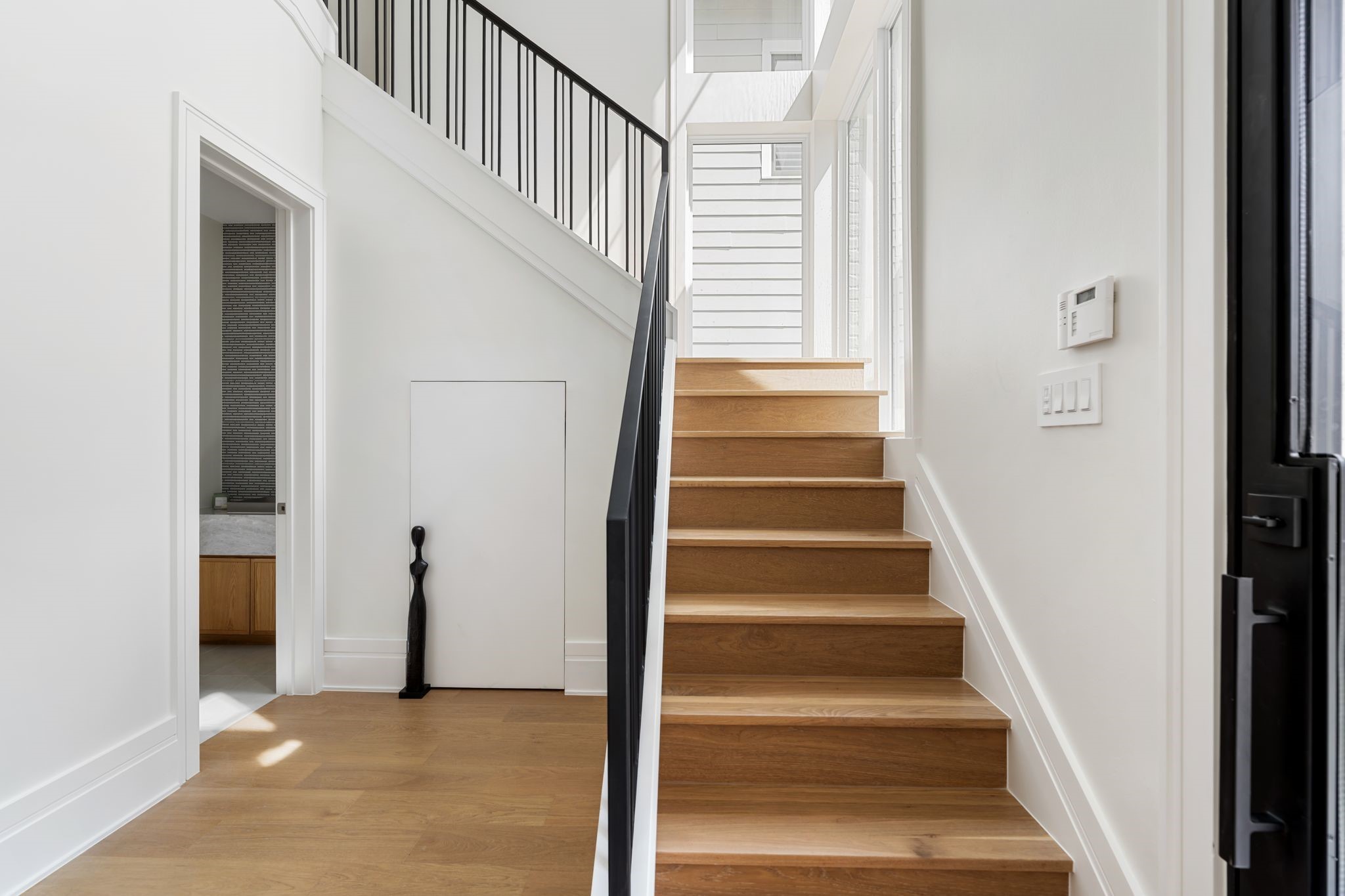 1023 Euclid Street Houston, TX 77009 - Photo 14 of 32 a view of entryway and hall with wooden floor
