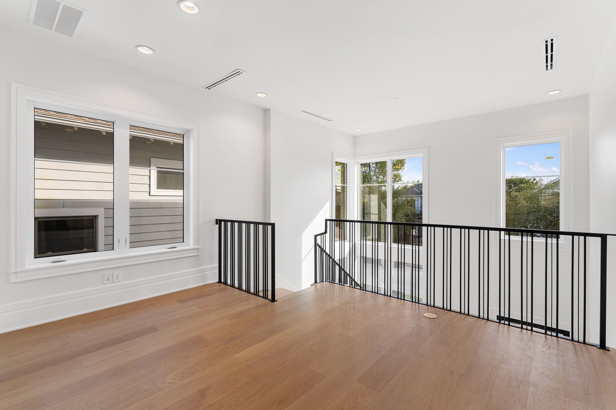 1023 Euclid Street Houston, TX 77009 - Photo 15 of 32 a view of a room with wooden floor and windows