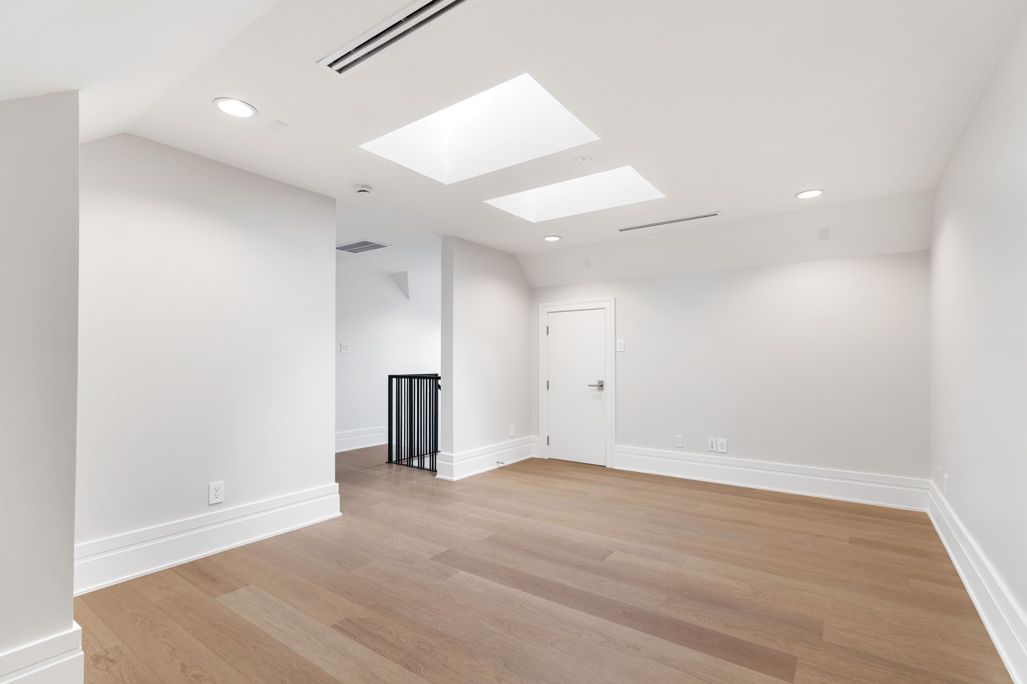 1023 Euclid Street Houston, TX 77009 - Photo 26 of 32 an empty room with wooden floor and natural light