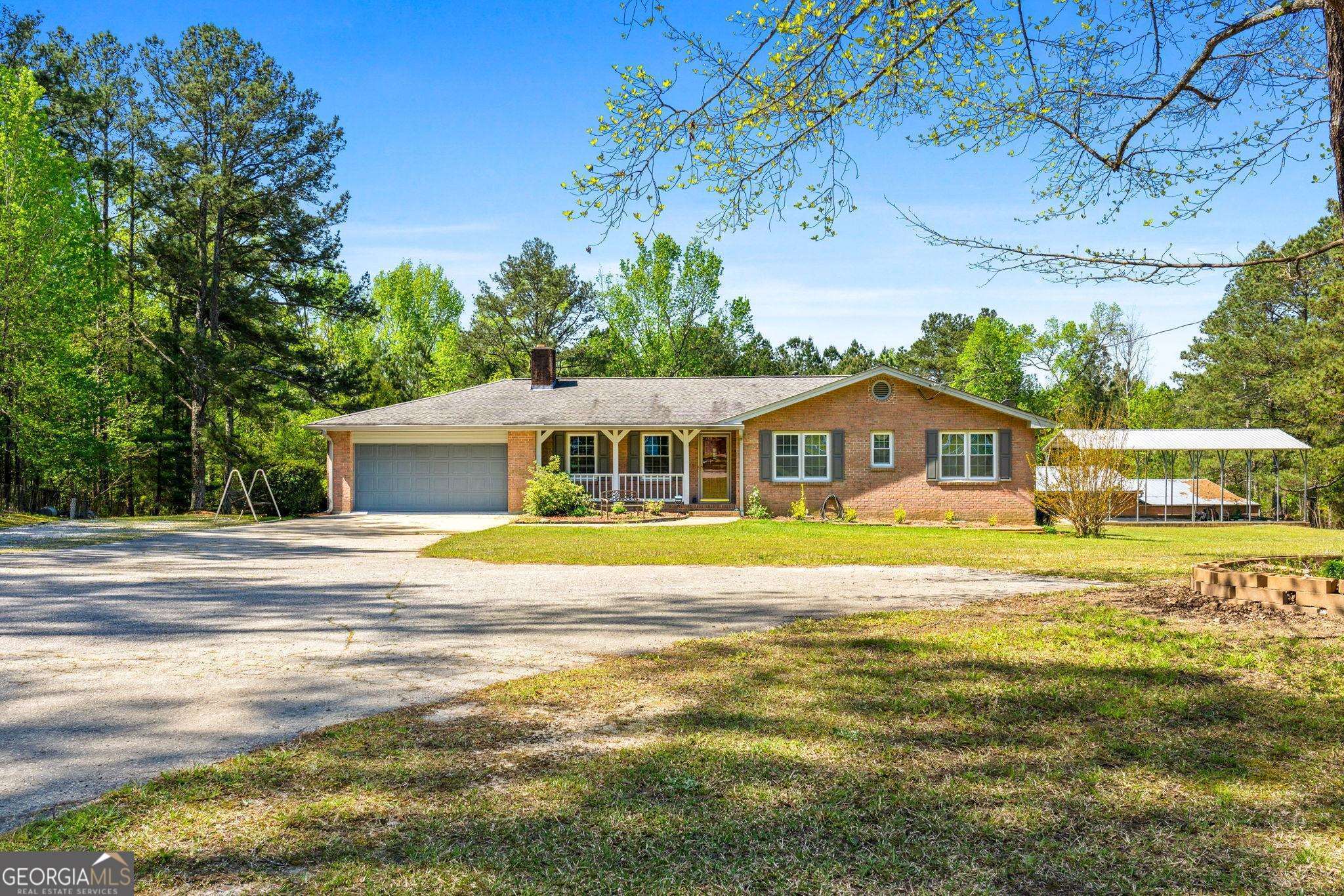 5697 Highway 155 North Stockbridge, GA 30281 - Photo 1 of 1 a front view of a house with a big yard
