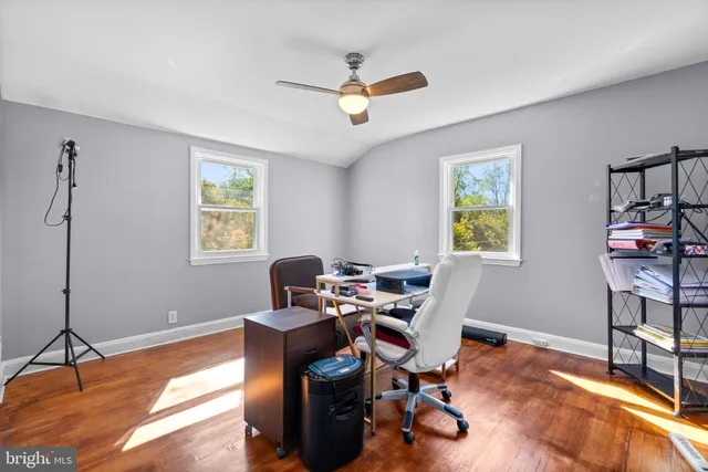 a work room with furniture and windows