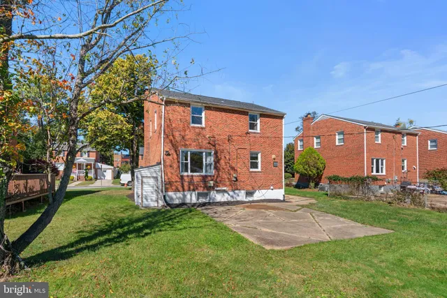 a view of a house with a yard porch and sitting area