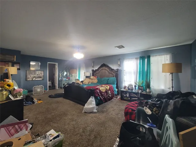 a bedroom with bed or couch and a window