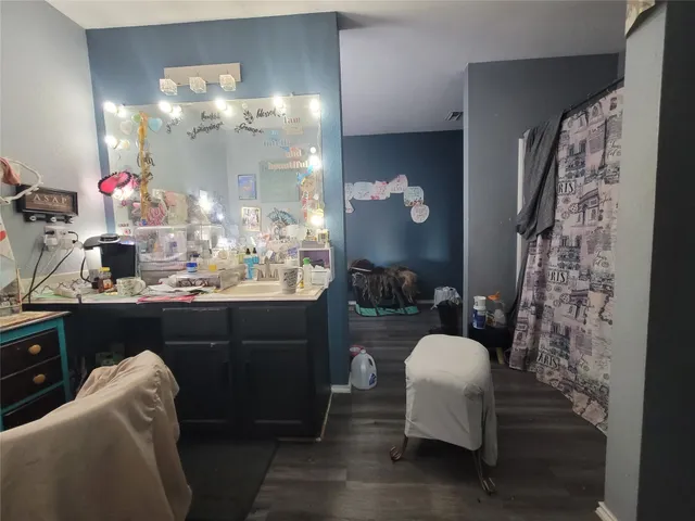 a living room with a couch and chandelier