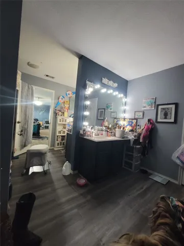 a room with lots of furniture and view kitchen