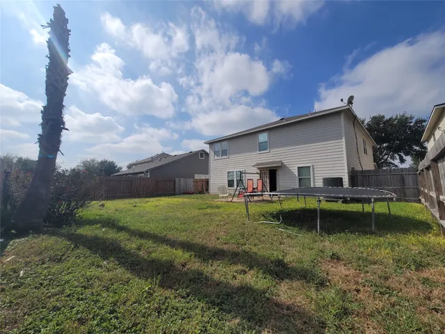 a backyard of a house with lots of green space