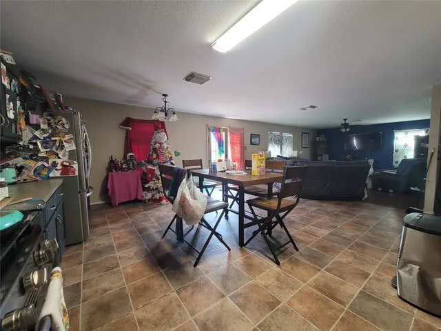 a view of a livingroom with furniture and a window