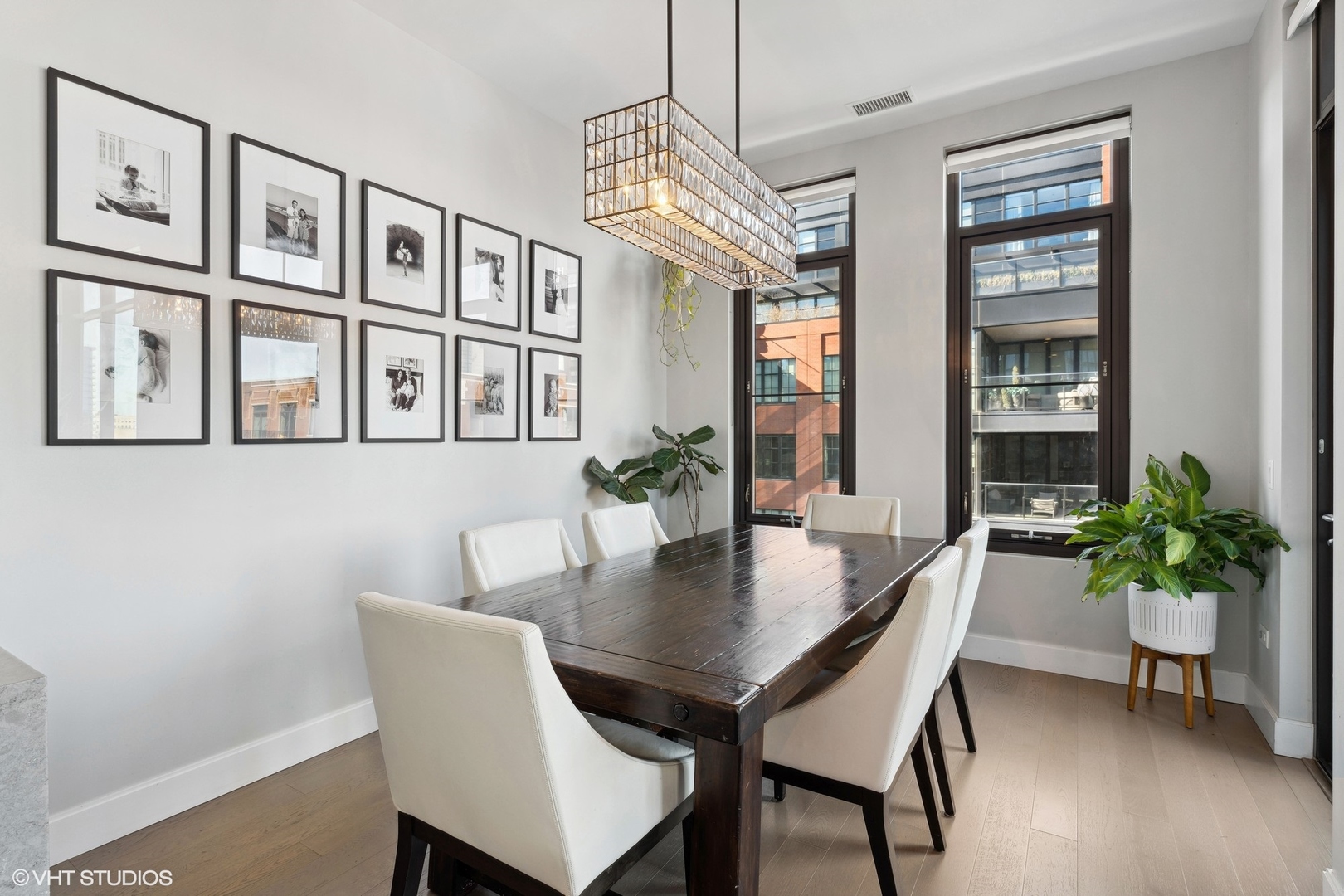 39 North Aberdeen Street, Unit PHN Chicago, IL 60607 - Photo 17 of 46 a view of a dining room with furniture window and wooden floor
