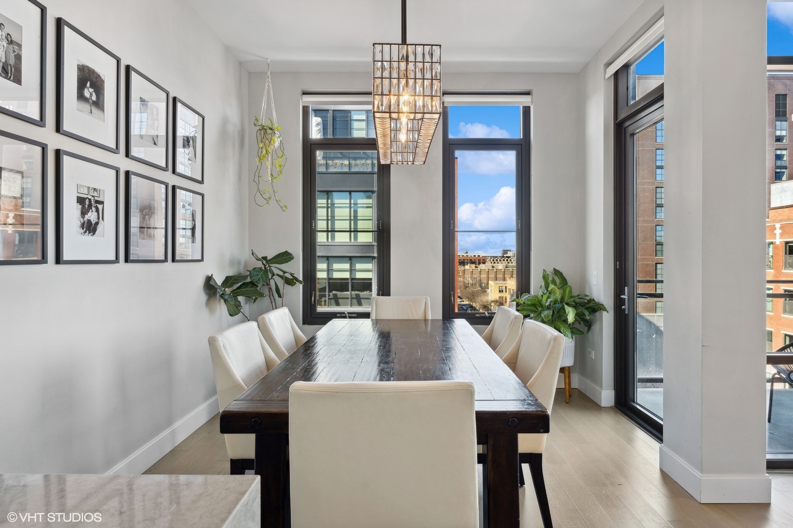 39 North Aberdeen Street, Unit PHN Chicago, IL 60607 - Photo 18 of 46 a living room with furniture and a chandelier