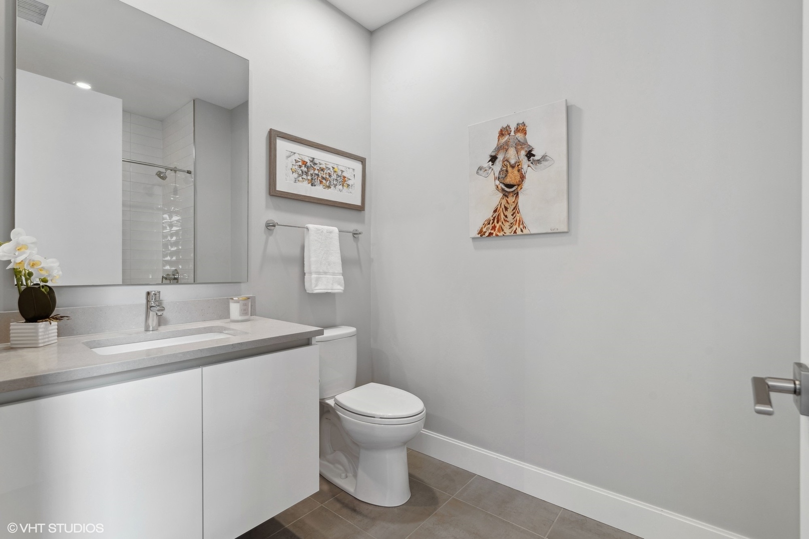 39 North Aberdeen Street, Unit PHN Chicago, IL 60607 - Photo 31 of 46 a bathroom with a toilet a sink and mirror