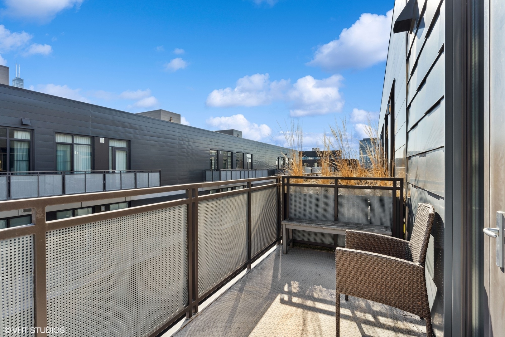 39 North Aberdeen Street, Unit PHN Chicago, IL 60607 - Photo 38 of 46 a view of a balcony with furniture and city view