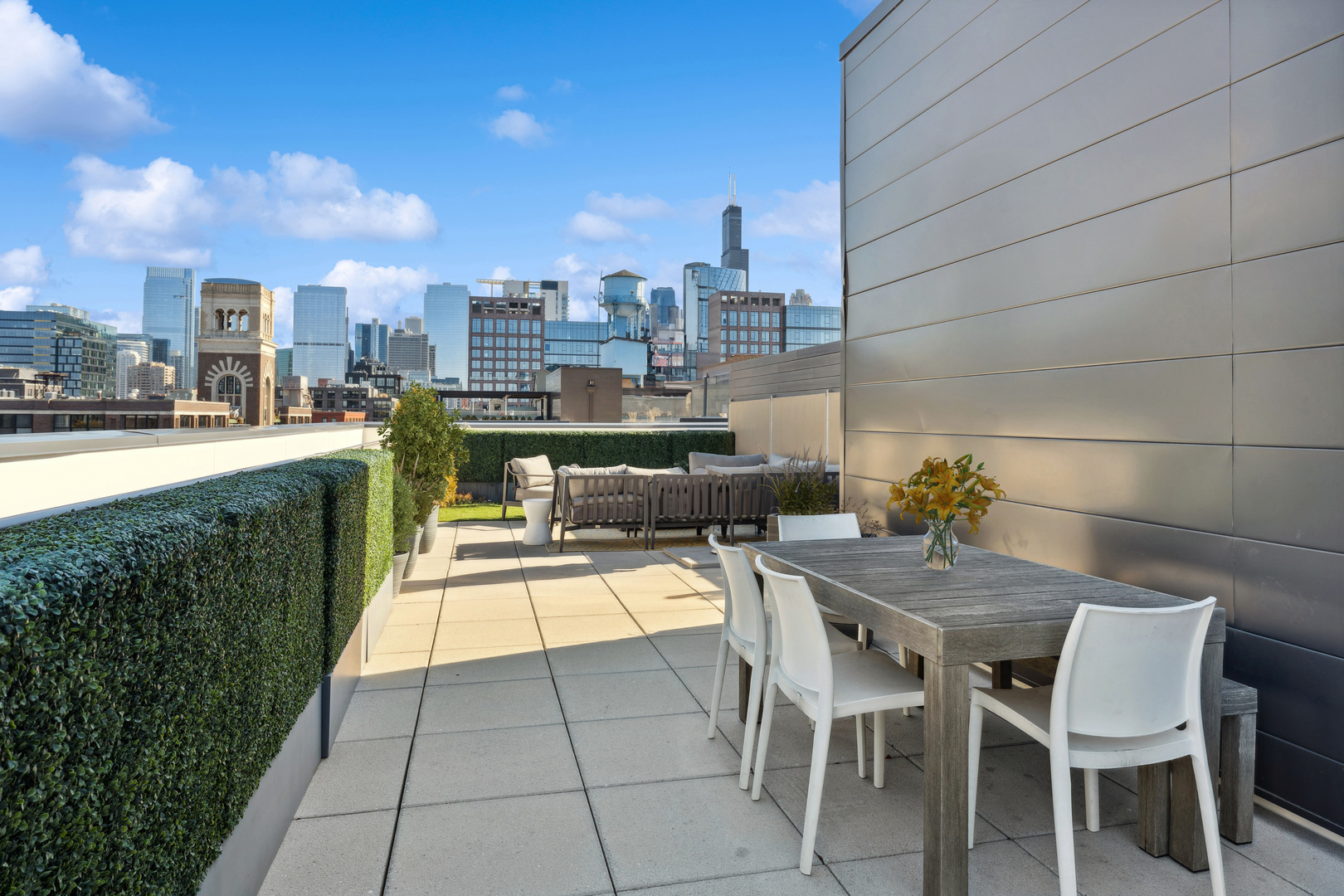 39 North Aberdeen Street, Unit PHN Chicago, IL 60607 - Photo 39 of 46 a view of a terrace with furniture and city view