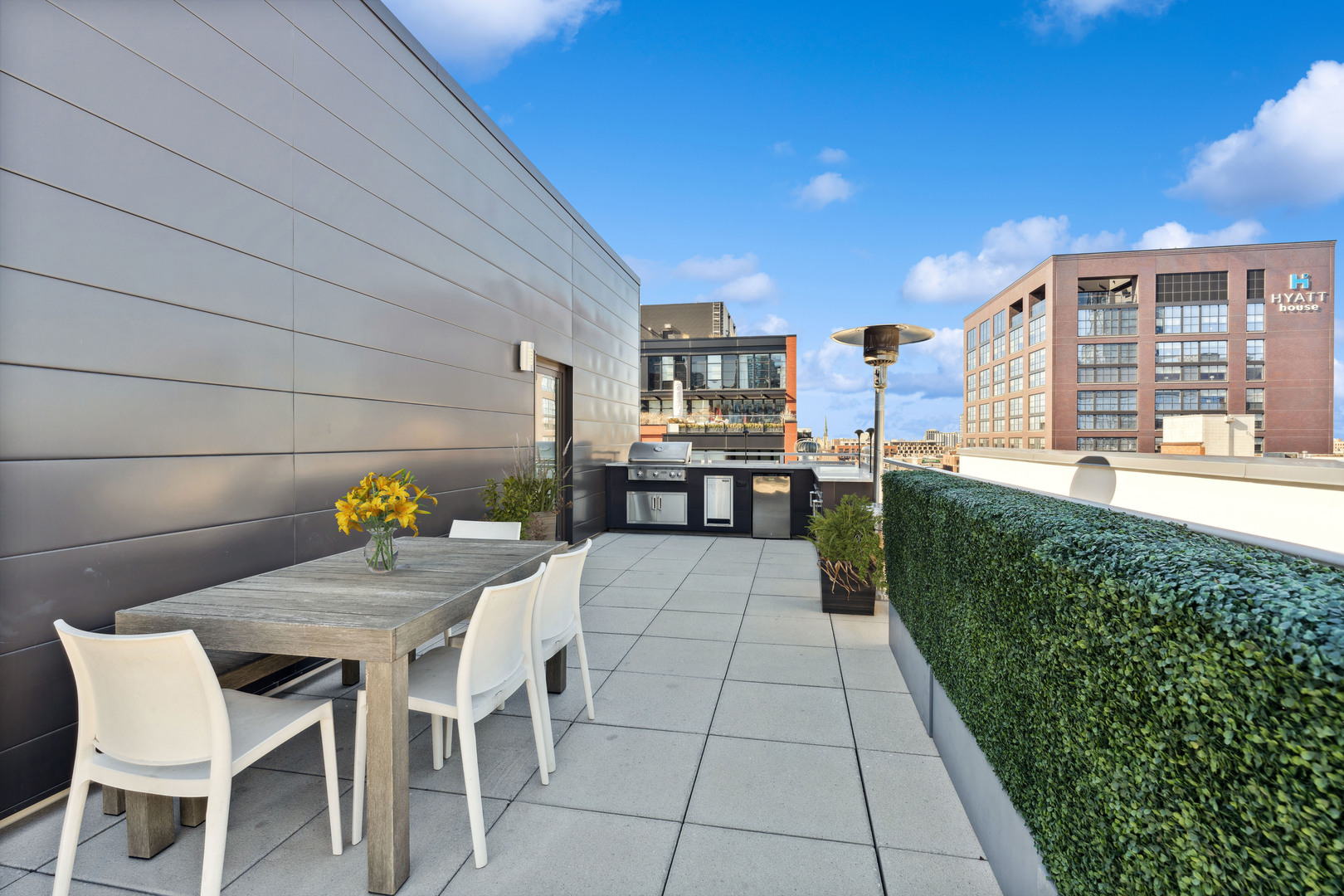 39 North Aberdeen Street, Unit PHN Chicago, IL 60607 - Photo 40 of 46 a view of a patio with table and chairs