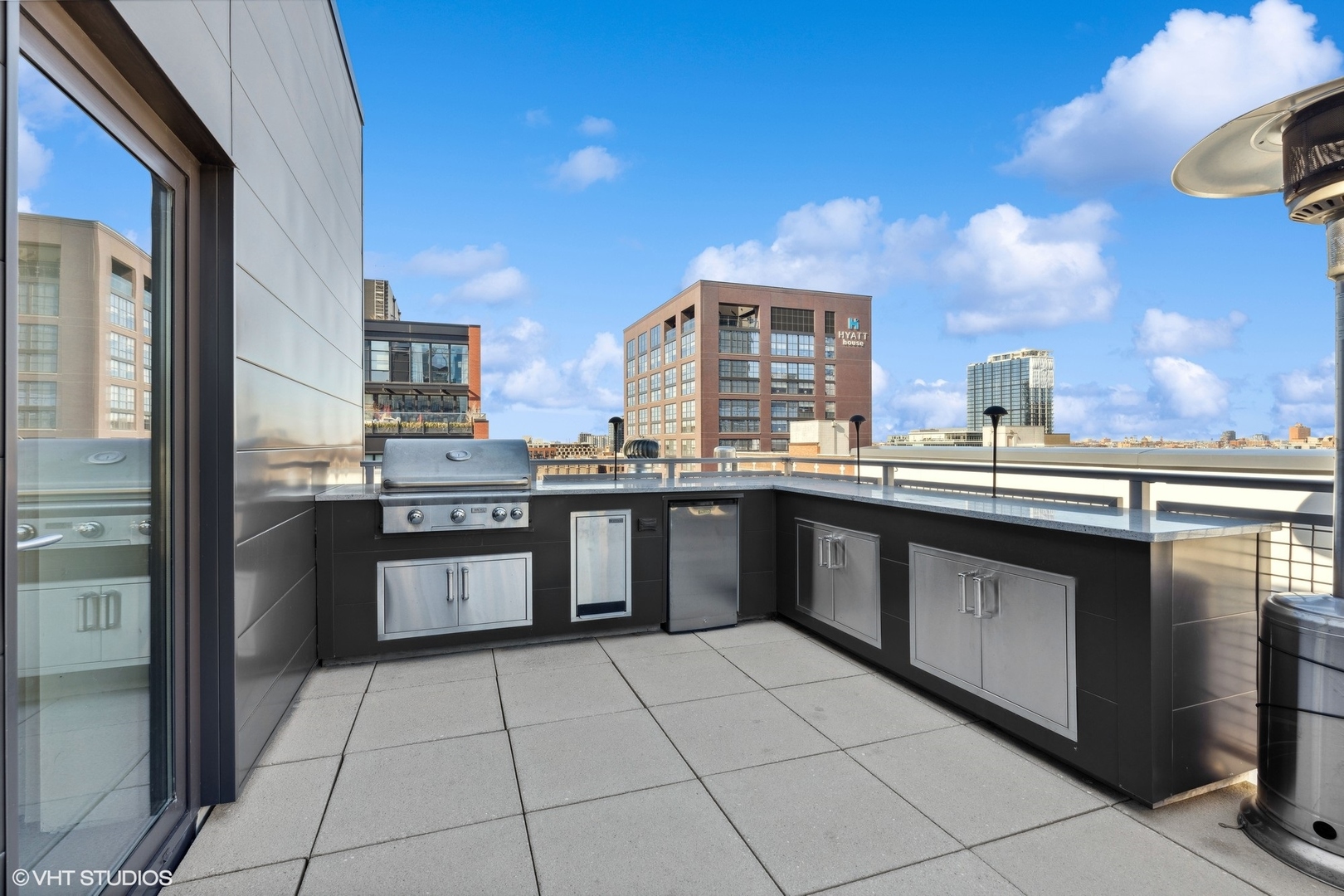 39 North Aberdeen Street, Unit PHN Chicago, IL 60607 - Photo 45 of 46 a kitchen with stainless steel appliances granite countertop a sink counter space and cabinets