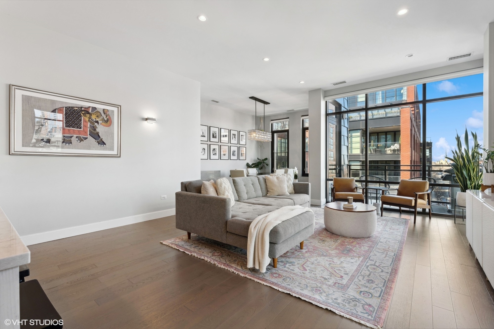 39 North Aberdeen Street, Unit PHN Chicago, IL 60607 - Photo 6 of 46 a living room with furniture and a large window