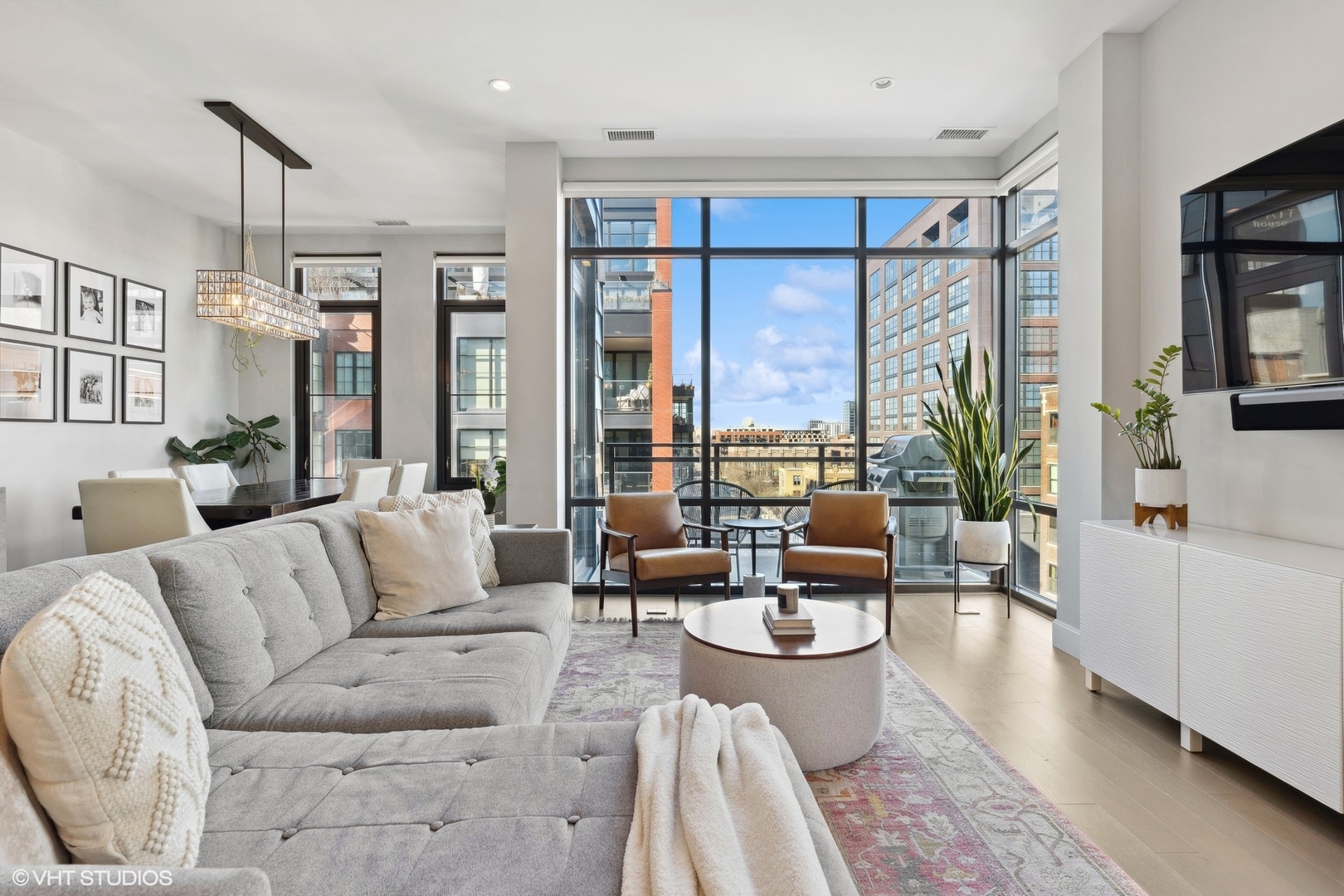 39 North Aberdeen Street, Unit PHN Chicago, IL 60607 - Photo 7 of 46 a living room with furniture and a large window