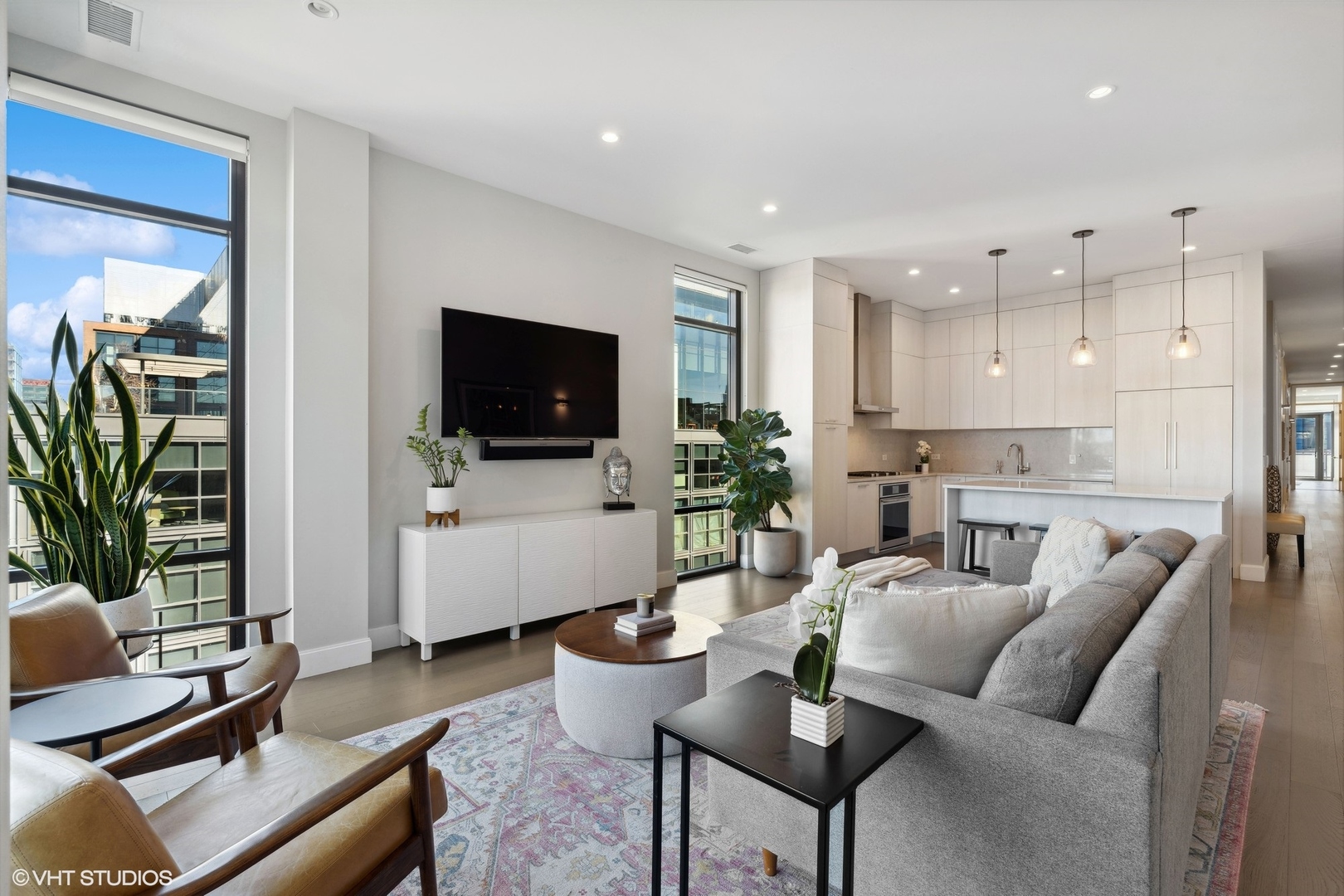 39 North Aberdeen Street, Unit PHN Chicago, IL 60607 - Photo 8 of 46 a living room with furniture and a flat screen tv