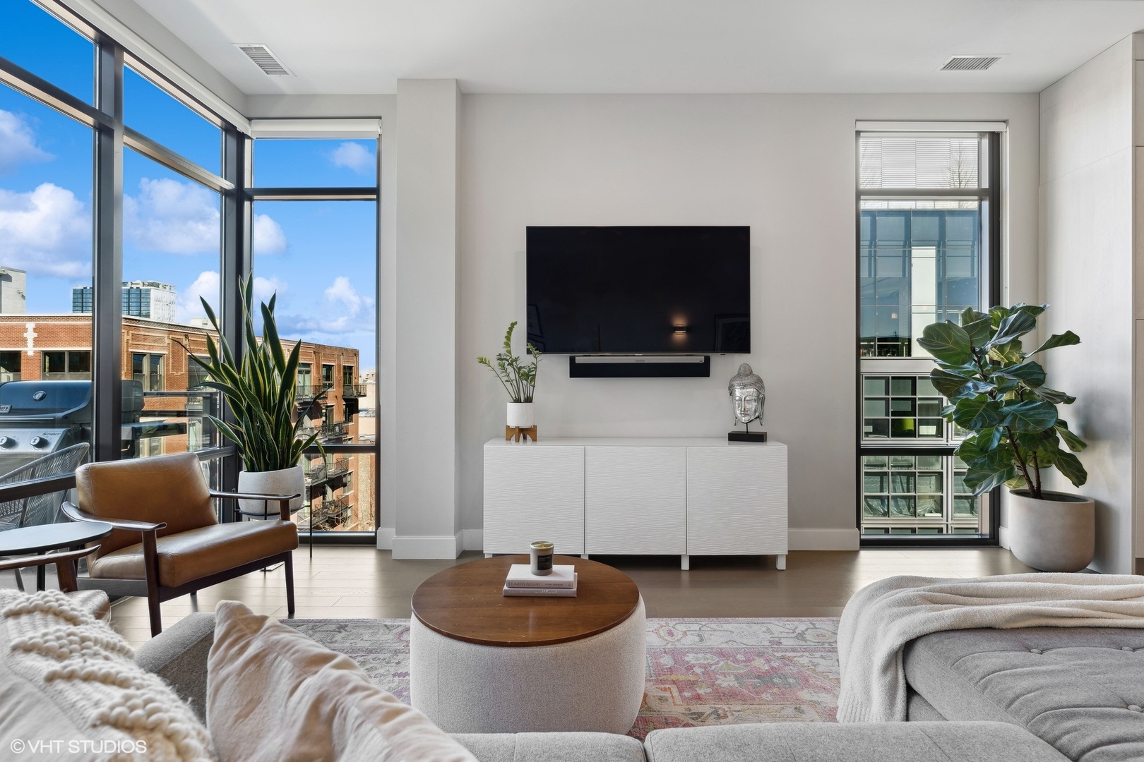 39 North Aberdeen Street, Unit PHN Chicago, IL 60607 - Photo 9 of 46 a living room with furniture and a flat screen tv